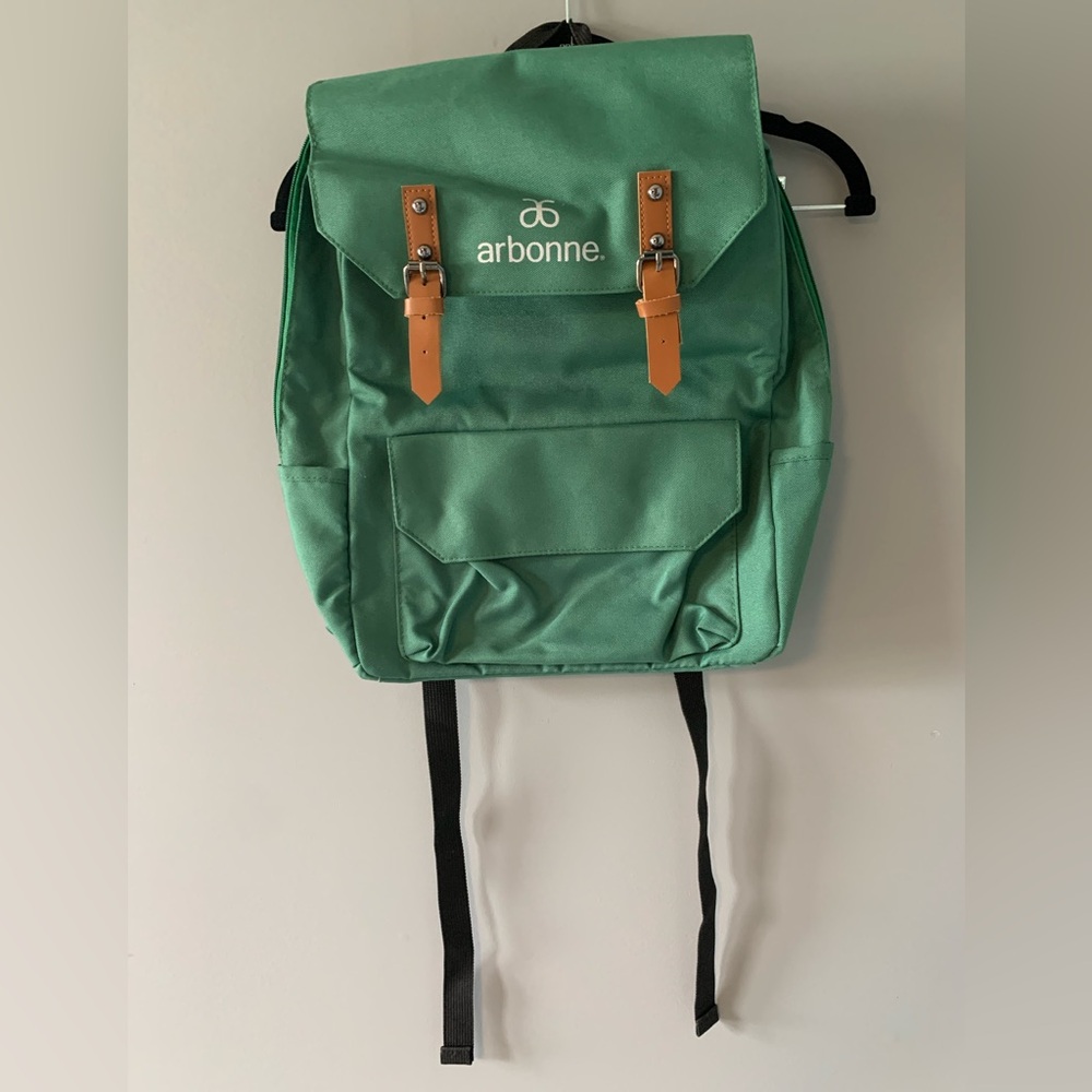 NWOT Arbonne Cute & Durable Green Backpack. Adjustable shoulder straps. Pockets.